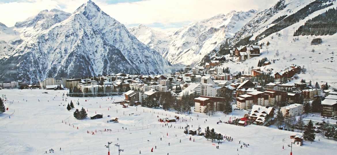 village covered with snow near mountains